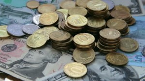 stock-footage-counter-clockwise-rotation-of-coins-american-dollars-russian-rubles-and-ukrainian-currency