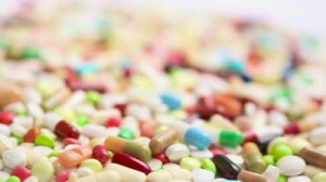 stock-footage-focusing-on-many-colorful-spinning-pills-and-drugs