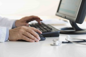 doctor with computer